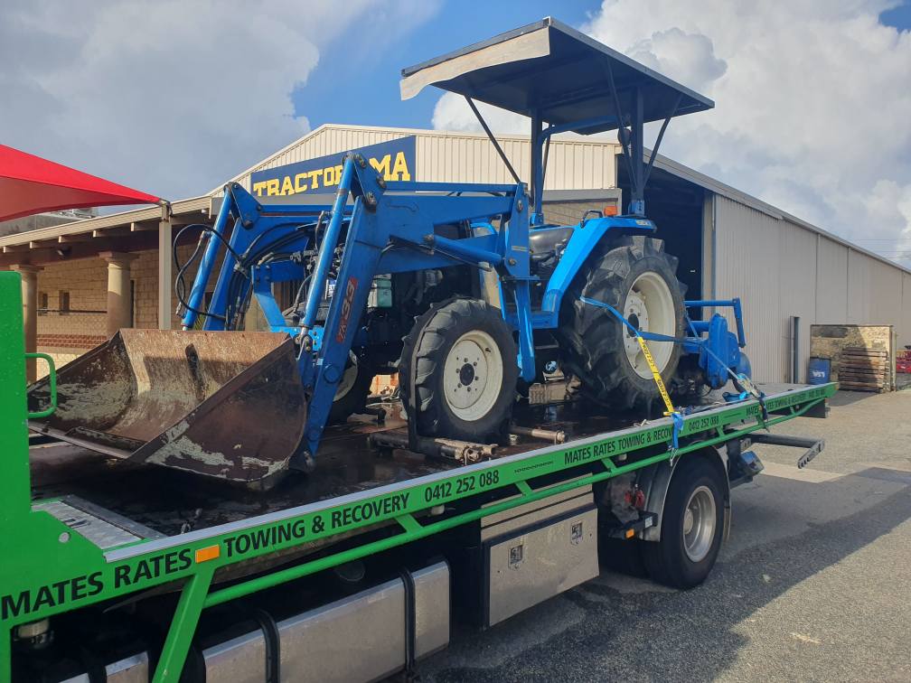Transporting a tractor on a tilt tray Perth